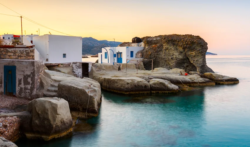 Boat houses in fishing village of Goupa on Kimolos island in Greece.